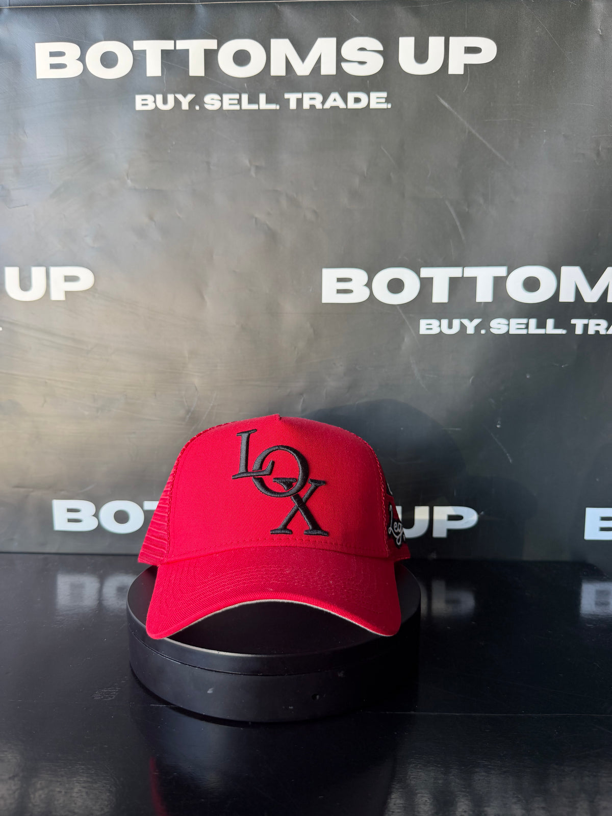 Legends Prevail x LOX Trucker Hat In Red