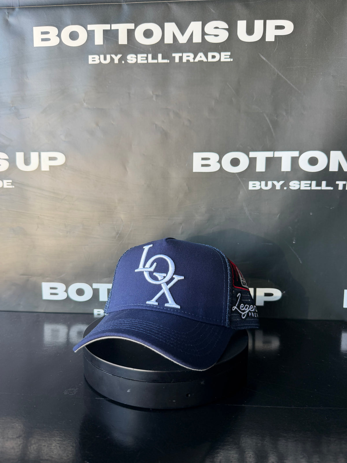 Legends Prevail x LOX Trucker Hat In Navy Blue