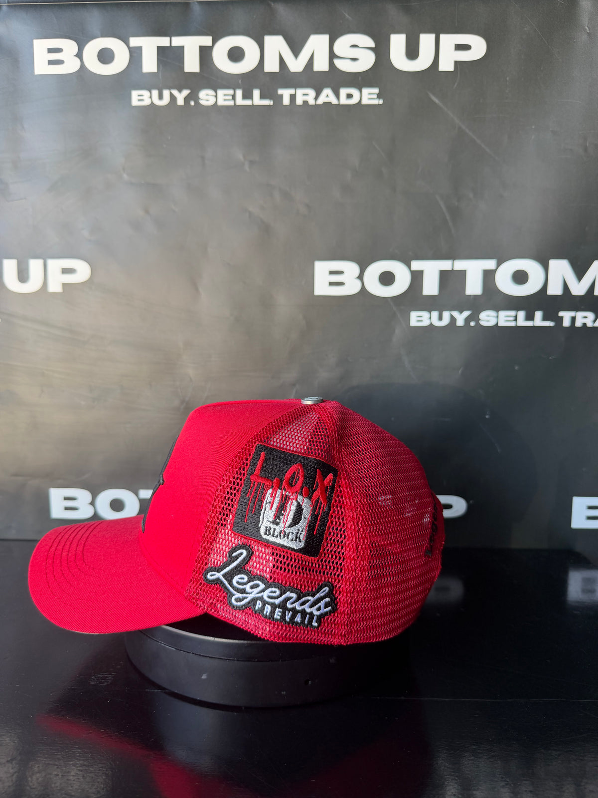 Legends Prevail x LOX Trucker Hat In Red