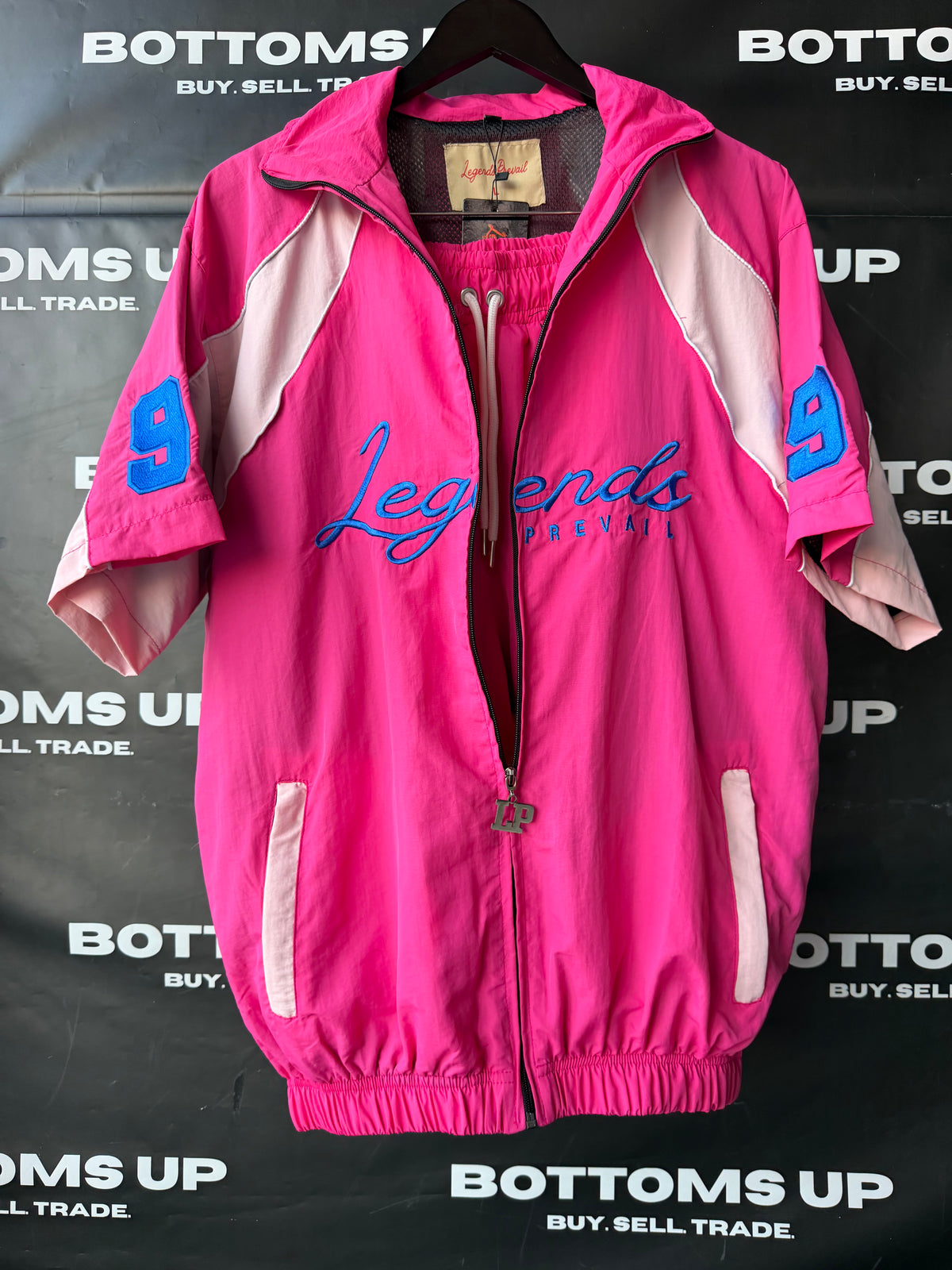 Legends Prevail Short Sleeve Windbreaker Set In Hot Pink
